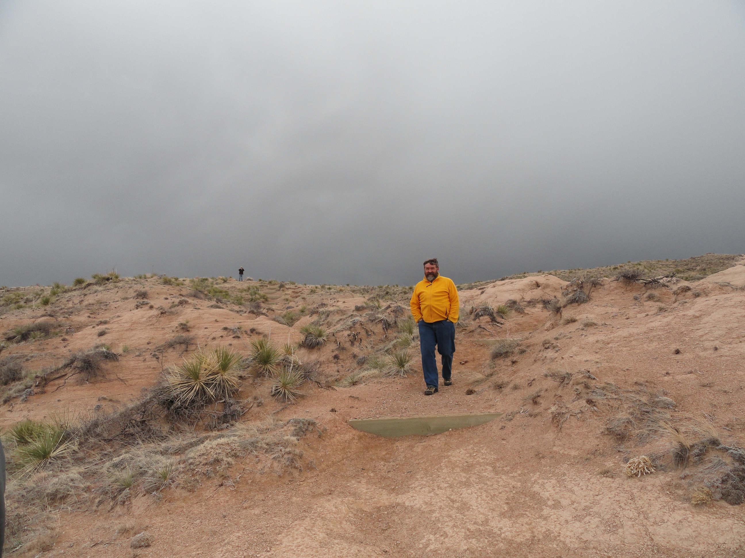 Bob, after shoveling 4,000 pounds of gravel, takes a much need break to take in the beauty of the plains . . . 