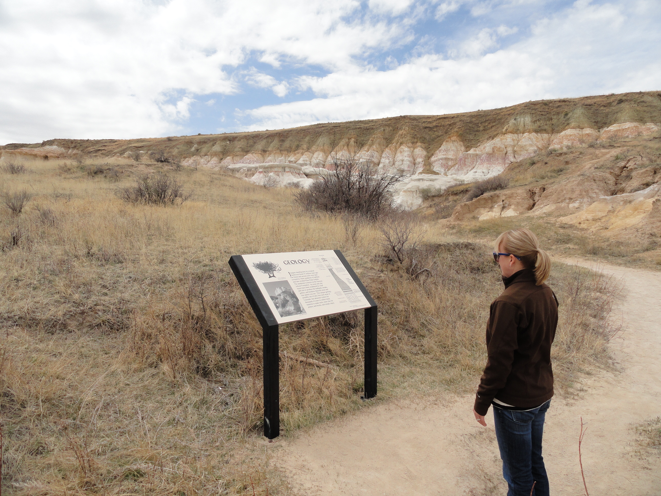 Interpretive signs explain the history, geology, and ecology of the area.