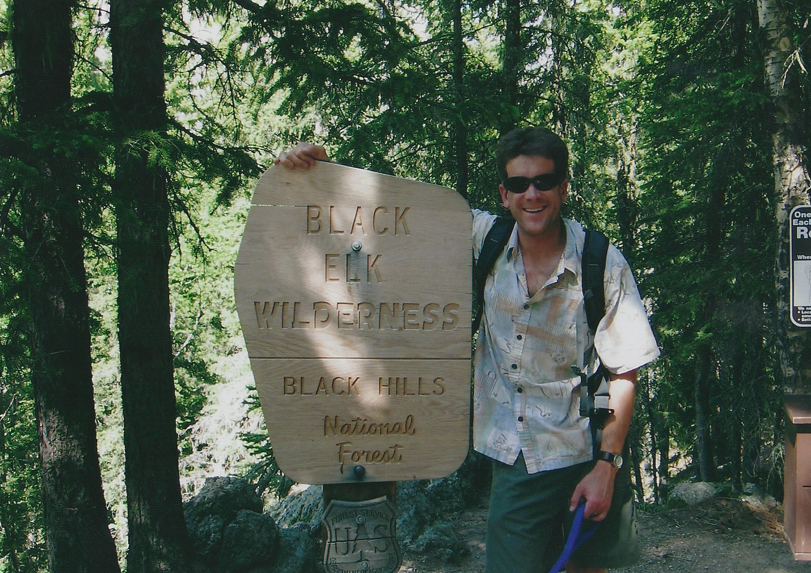 The author, in about 2005, at the Black Elk Wilderness sign.